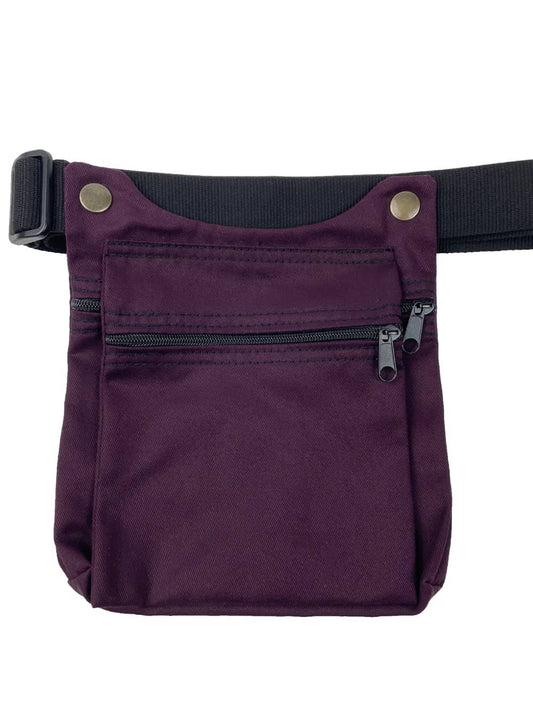 Riñonera artesanal de tela en color morado